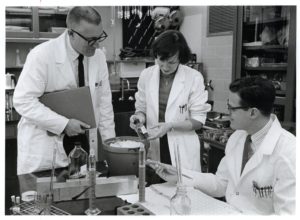 From left to right: Dr. Harry M. Meyer Jr, Scientist Hope Hopps, and Dr. Paul D. Parkman of the Laboratory of Viral Immunology, Division of Biologics Standards working with rubella antigen in laboratory.